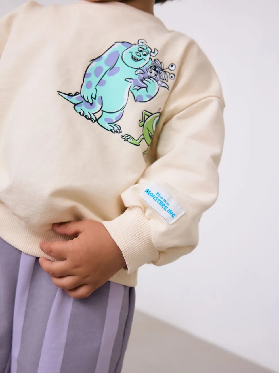 Ecru White Monsters, Inc Long Sleeve Top and Barrel Leg Trousers (3mths-7yrs)