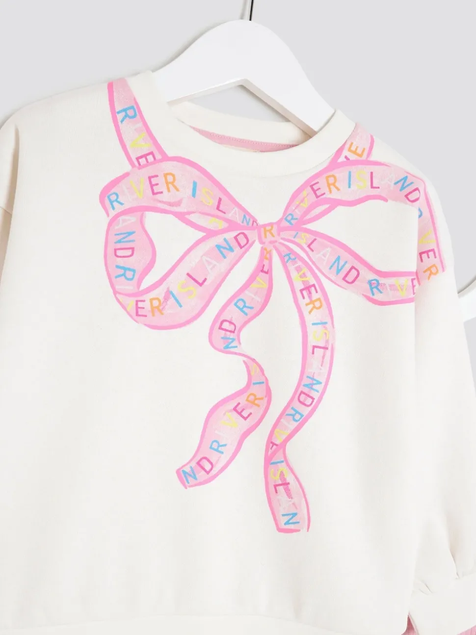River Island Cream Bow Sweatshirt & Rainbow Waistband Kickflare Leggings Set