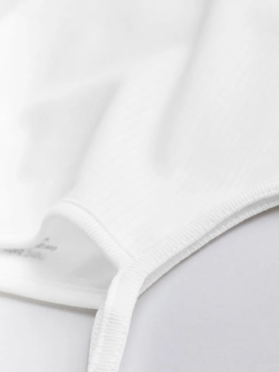 White 7 Pack Baby Strappy Bodysuits